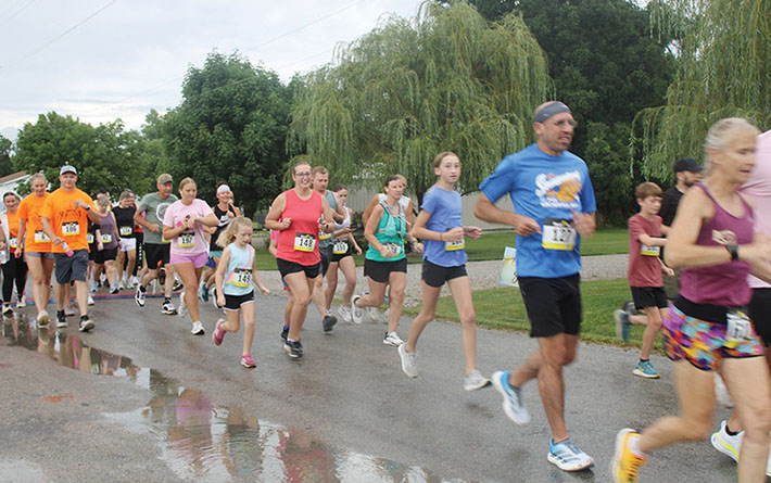 Rain doesn't dampen spirits at annual 'Who's the Fairest 5K'