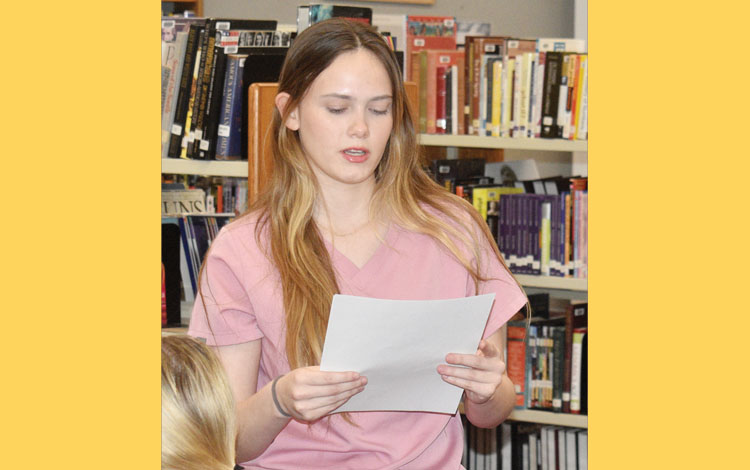 Players and parents speak in support of Carlyle coach